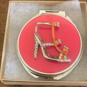 Betsy Johnson’s Compact Mirror.